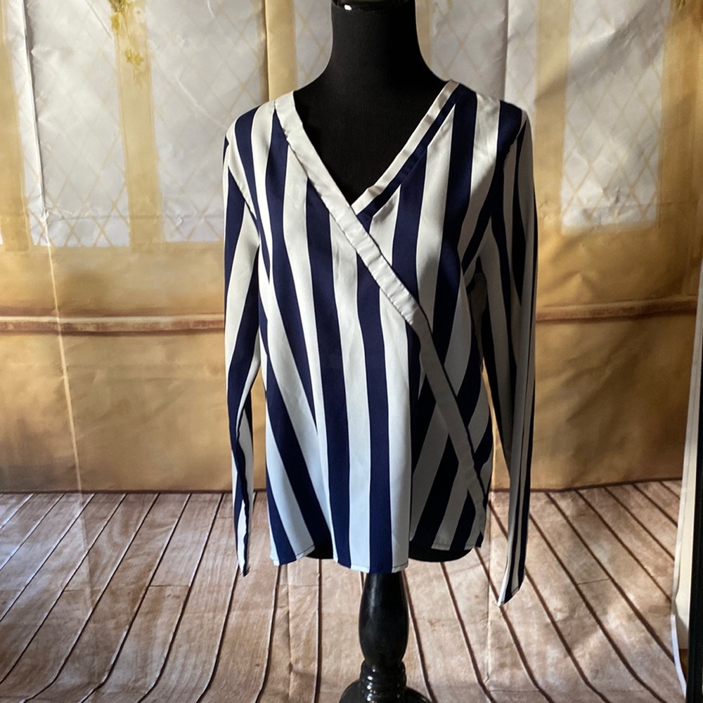 Very nice blouse , brand new, silk 100 percent. Navy blue and white strips.